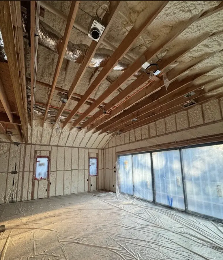 Interior walls and ceiling insulated with spray foam during new construction in Tipton